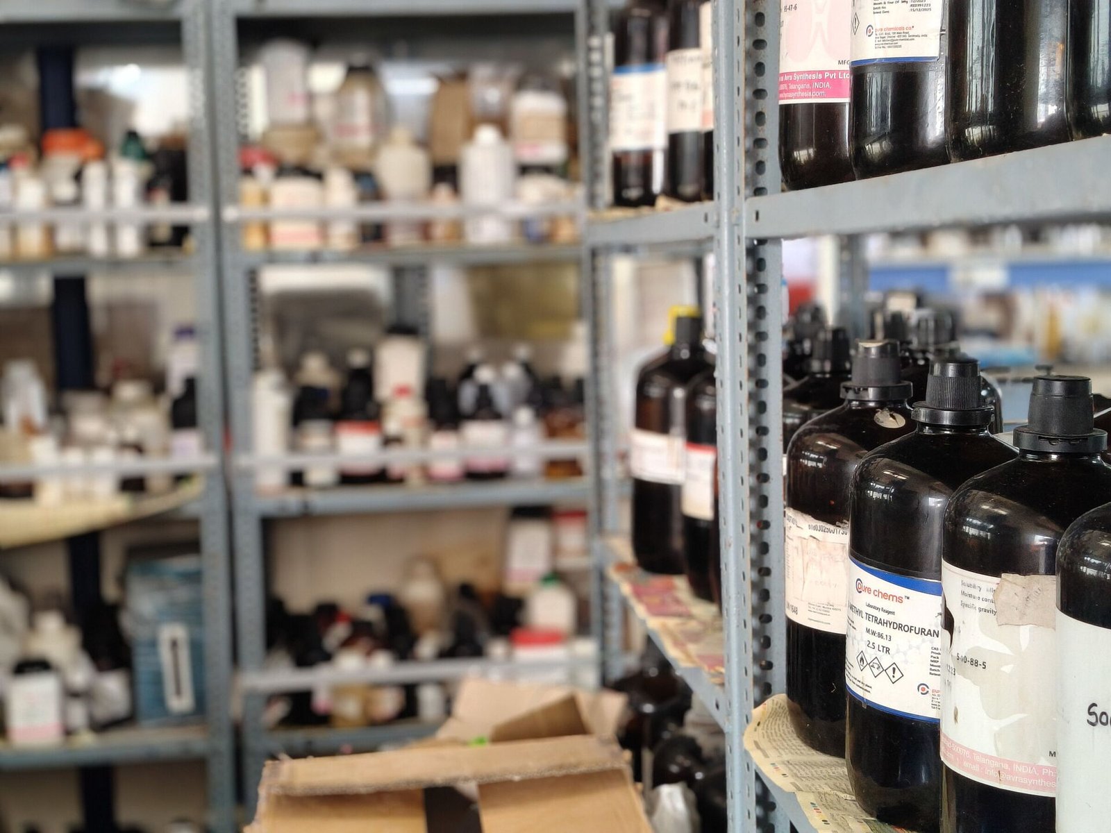Shelves of laboratory reagents and solvents in the chemical store