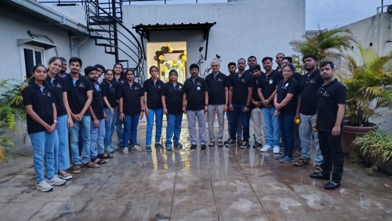 The Mana Pharma team in matching black T-shirts at the 7th anniversary celebration