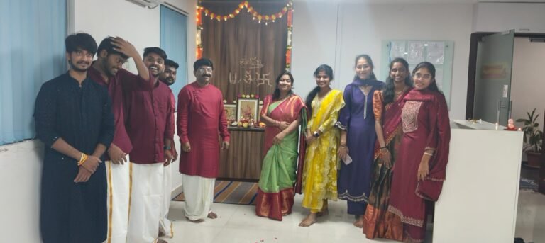 Team in traditional dress at the Diwali puja in the office