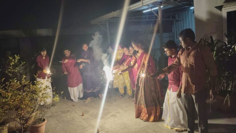 Team lighting sparklers on the terrace for Diwali